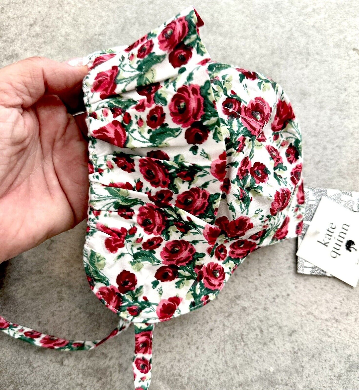 Kate Quinn Ruffle Bonnet Rose Design. Price $16 3-6 M