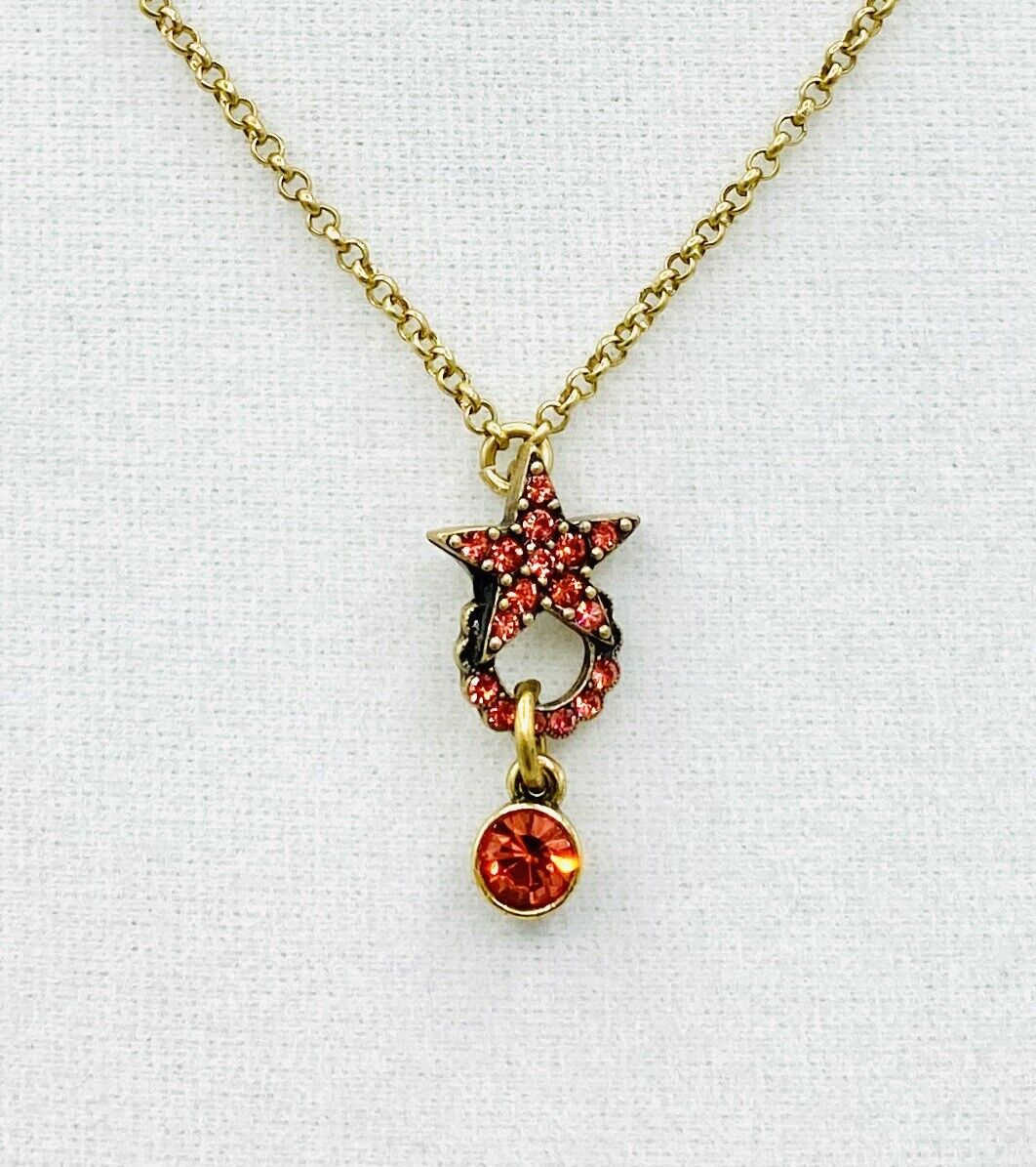 PILGRIM SWAROVSKI CRYSTAL GOLD PLATED Coral Red Star Necklace. PRICE $16